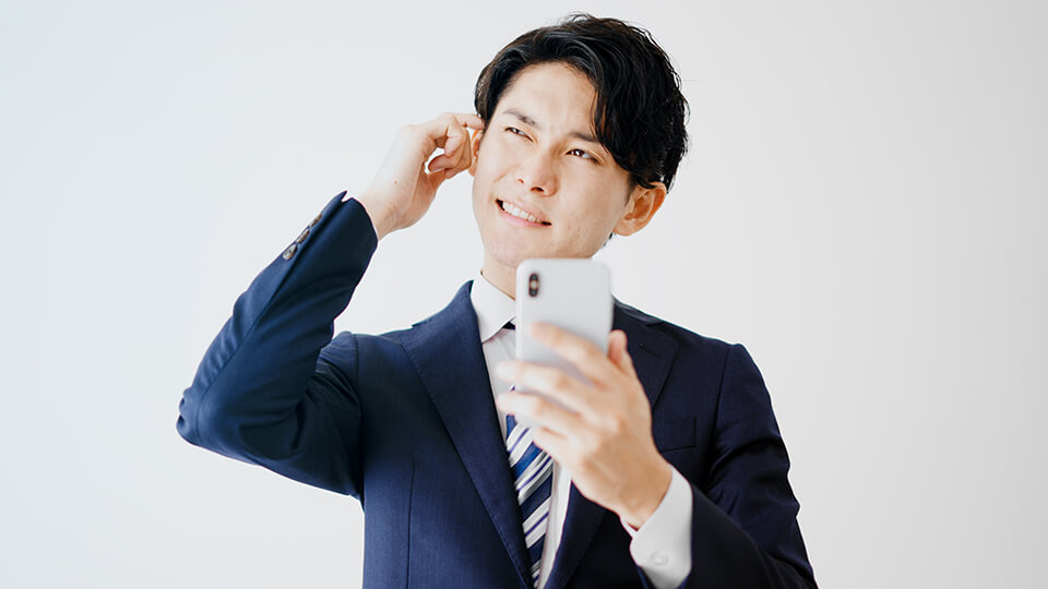 スーツ_スマホ_失敗した顔_男